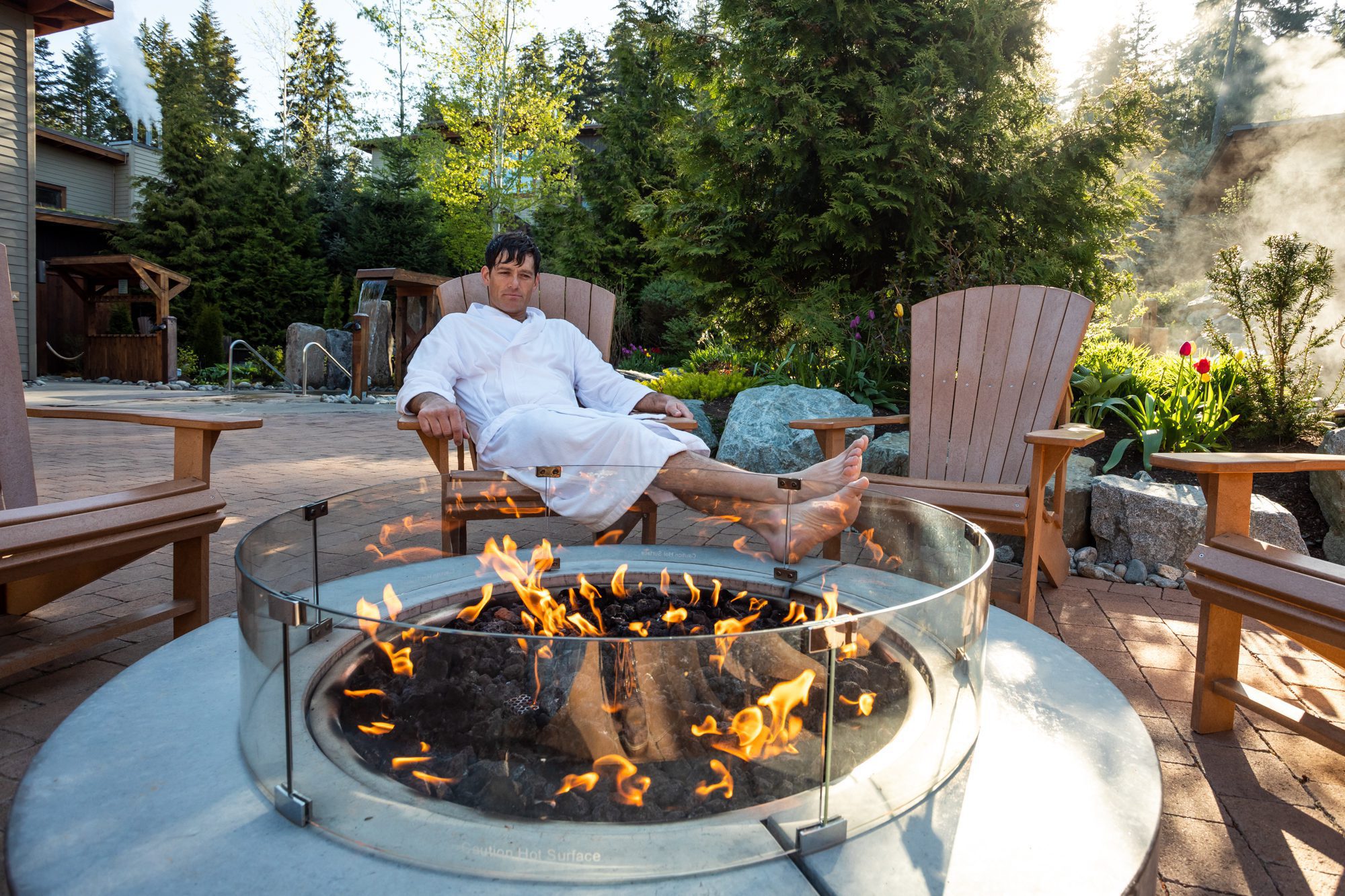 man relaxing fireside at scandinave whistler